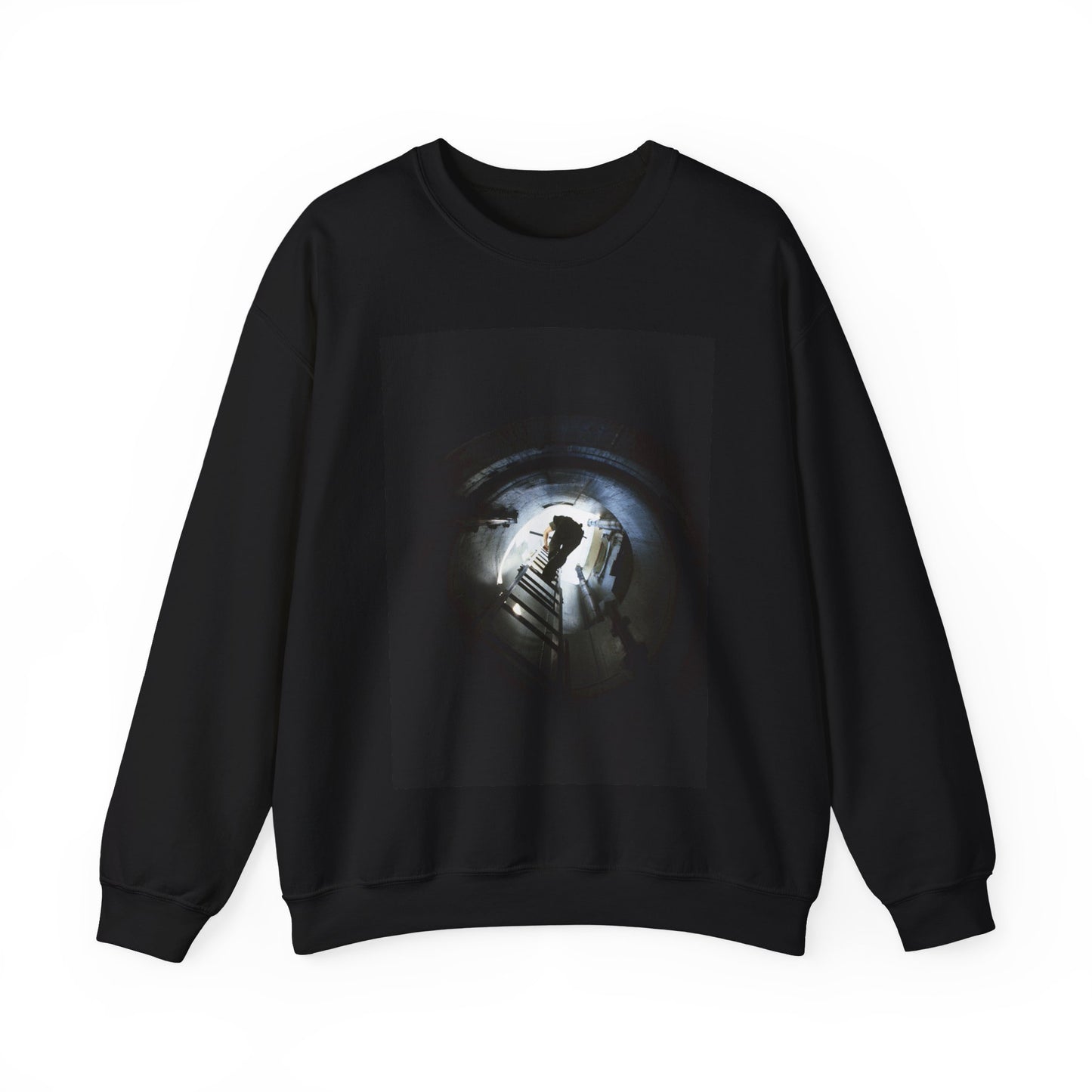 A 44th Field Missile Maintenance Squadron maintenance technician climbs down a ladder into a Minuteman missile support facility Black Heavy Blend Adult Crew Neck SweatShirt