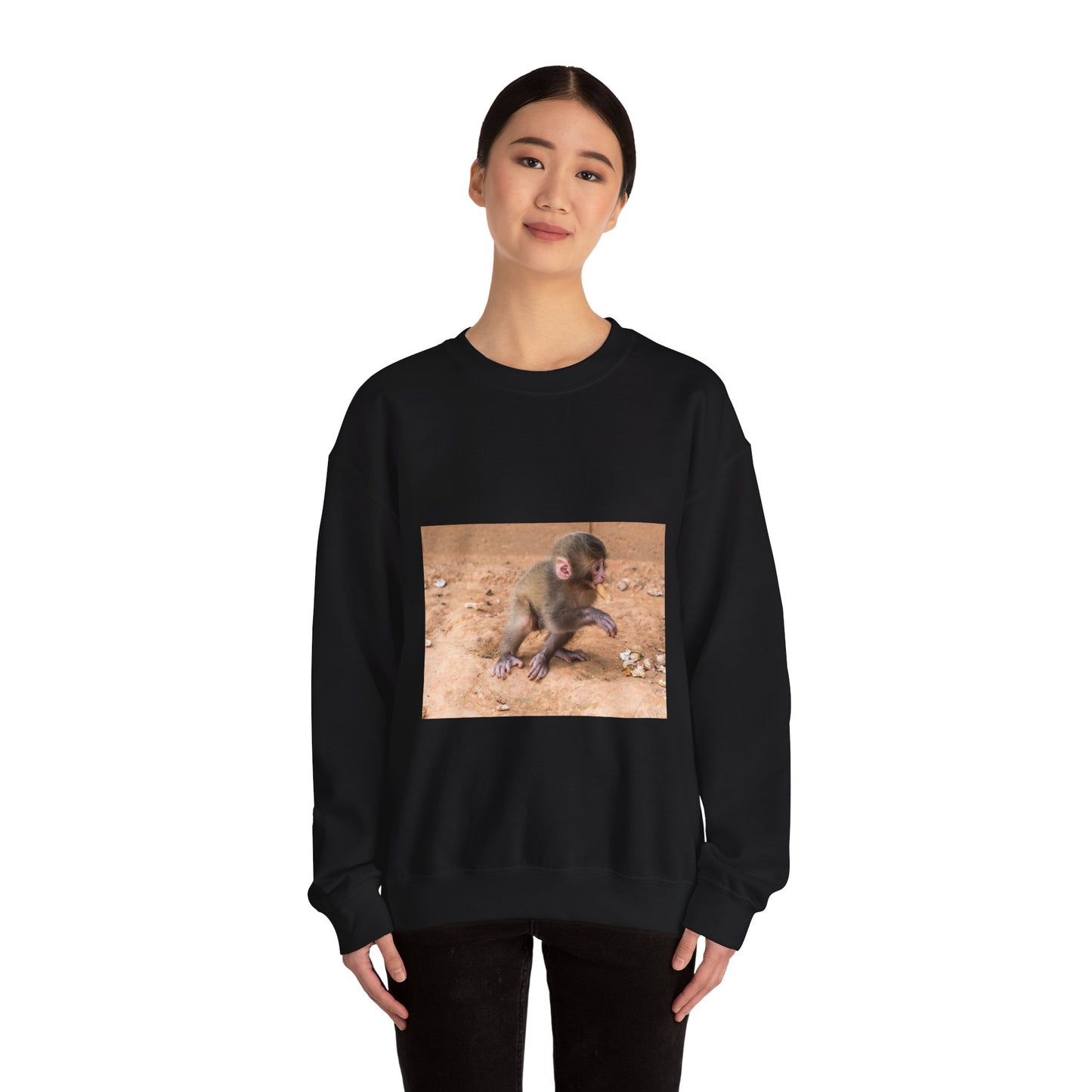 Public domain stock image. Monkey baby eating peanut. Black Heavy Blend Adult Crew Neck SweatShirt