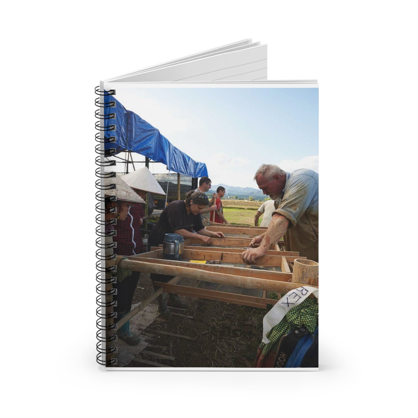 Local workers gather around Dr. Kimberly Maeyama, Defense Spiral Bound Ruled Notebook with Printed Cover
