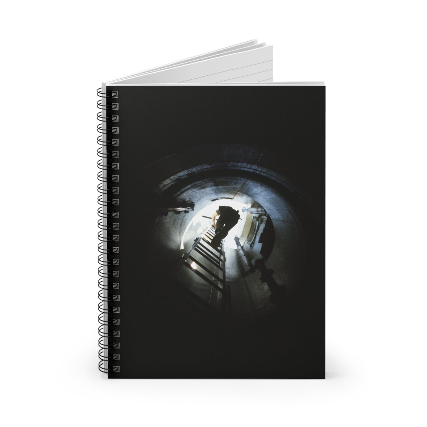 A 44th Field Missile Maintenance Squadron maintenance technician climbs down a ladder into a Minuteman missile support facility Spiral Bound Ruled Notebook with Printed Cover