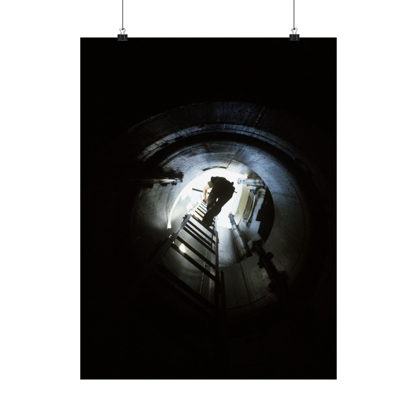 A 44th Field Missile Maintenance Squadron maintenance technician climbs down a ladder into a Minuteman missile support facility High Quality Matte Wall Art Poster for Home, Office, Classroom