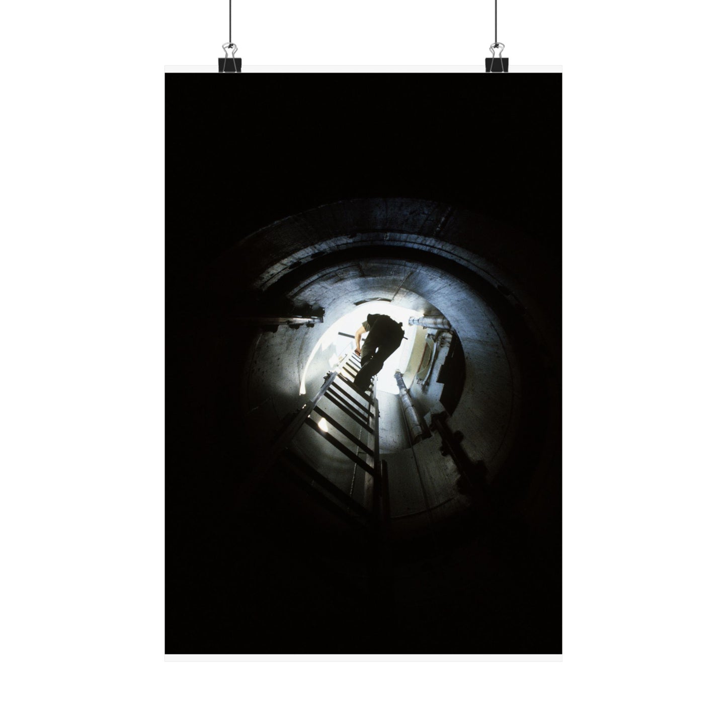 A 44th Field Missile Maintenance Squadron maintenance technician climbs down a ladder into a Minuteman missile support facility High Quality Matte Wall Art Poster for Home, Office, Classroom