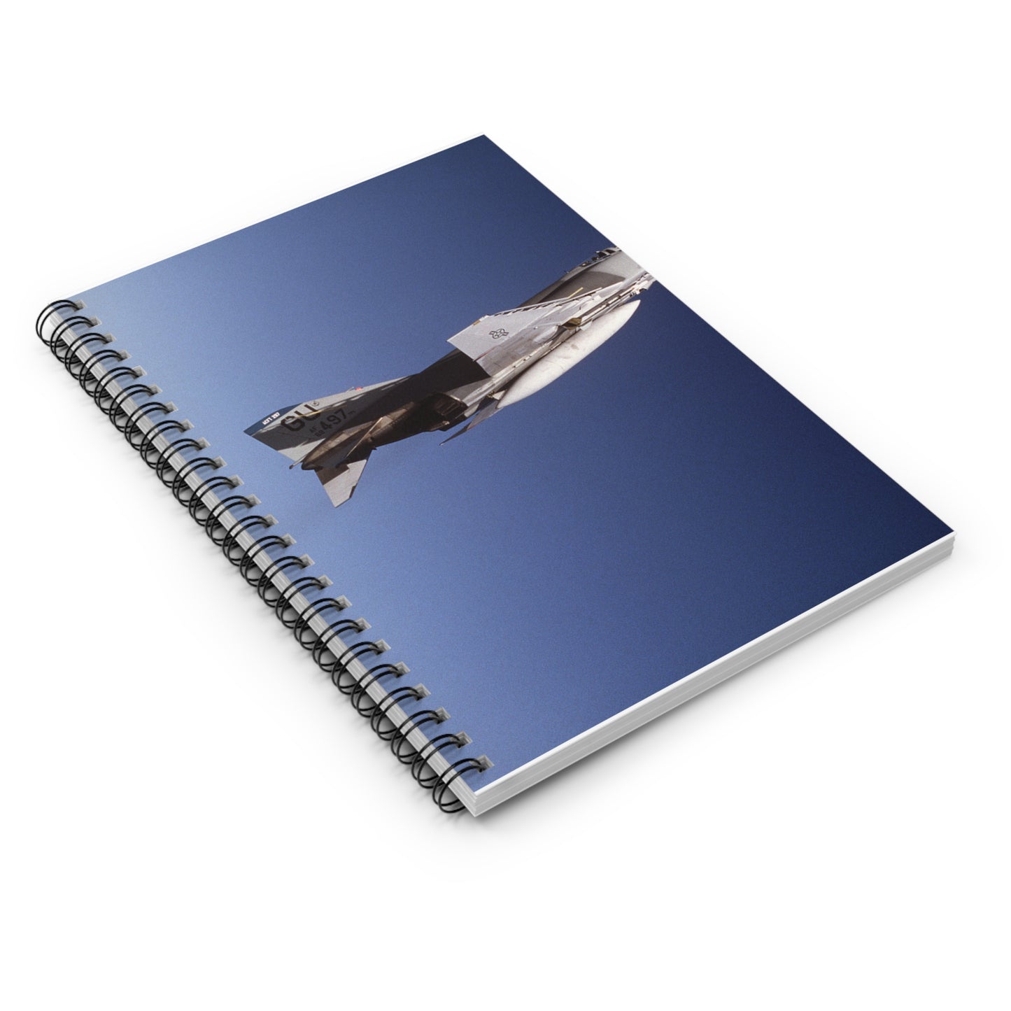 An air-to-air right side view of a 497th Tactical Fighter Squadron F-4E Phantom II aircraft in a vertical climb during Exercise TEAM SPIRIT'86. The aircraft is armed with an AIM-9 Sidewinder missile Spiral Bound Ruled Notebook with Printed Cover