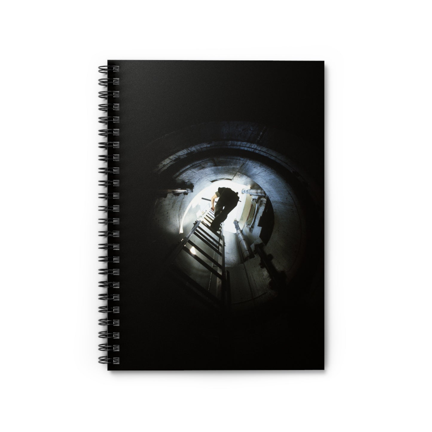 A 44th Field Missile Maintenance Squadron maintenance technician climbs down a ladder into a Minuteman missile support facility Spiral Bound Ruled Notebook with Printed Cover