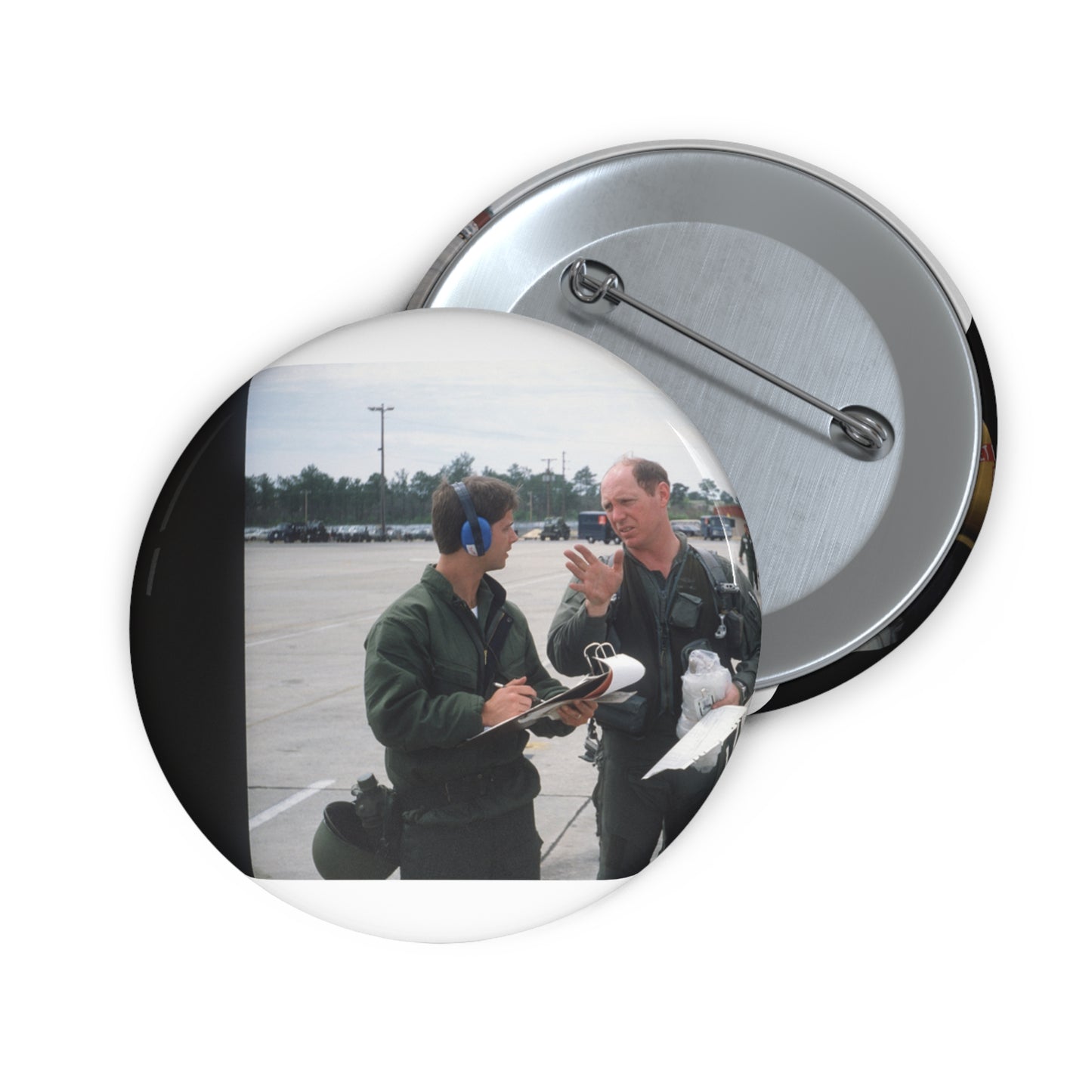 Colonel Tom Barber (right), director of operations, 33rd Tactical Fighter Wing (33rd TFW) is debriefed by First Lieutenant Robert M. Haire (left), intelligence officer, 33rd TFW Pin Buttons with Crisp Design
