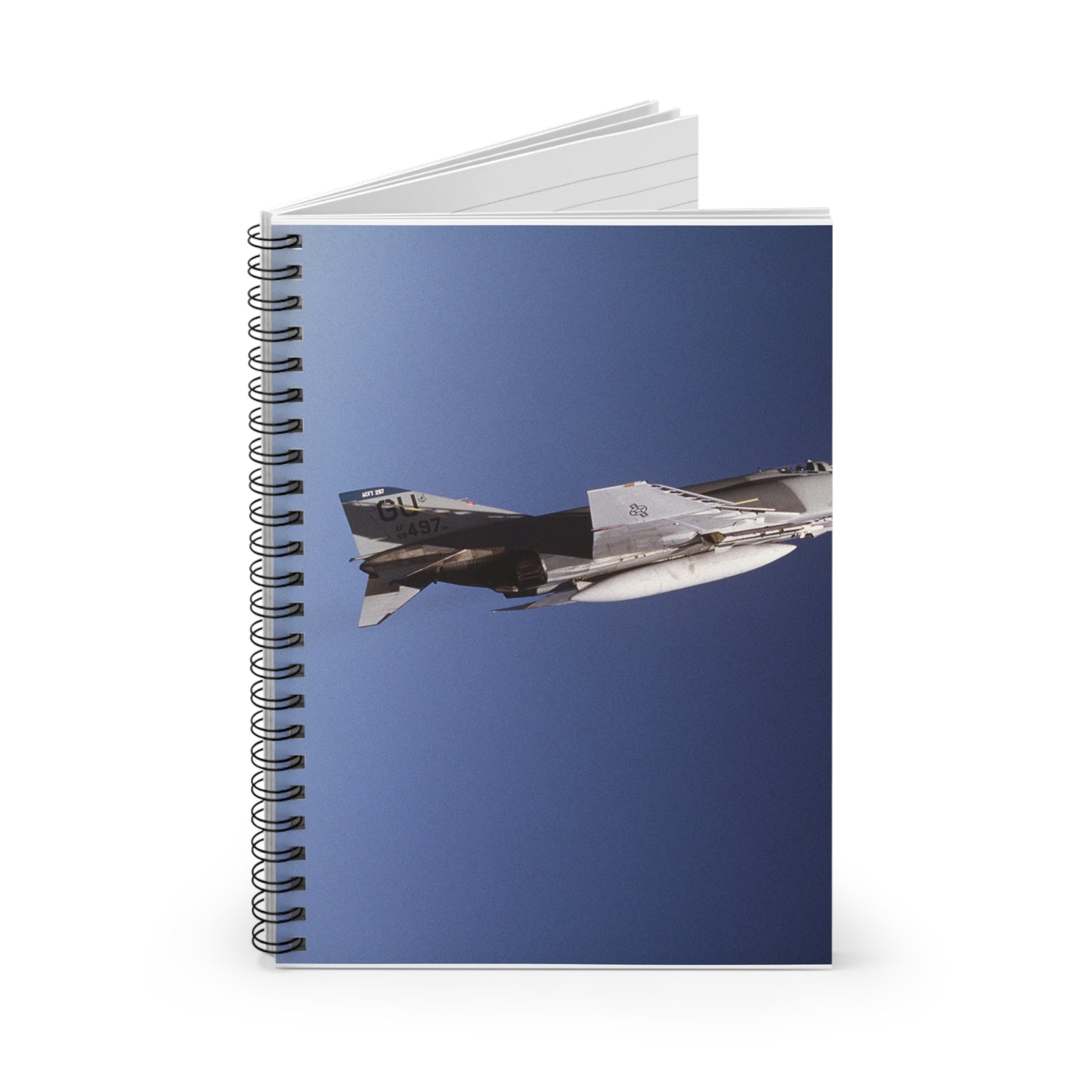An air-to-air right side view of a 497th Tactical Fighter Squadron F-4E Phantom II aircraft in a vertical climb during Exercise TEAM SPIRIT'86. The aircraft is armed with an AIM-9 Sidewinder missile Spiral Bound Ruled Notebook with Printed Cover