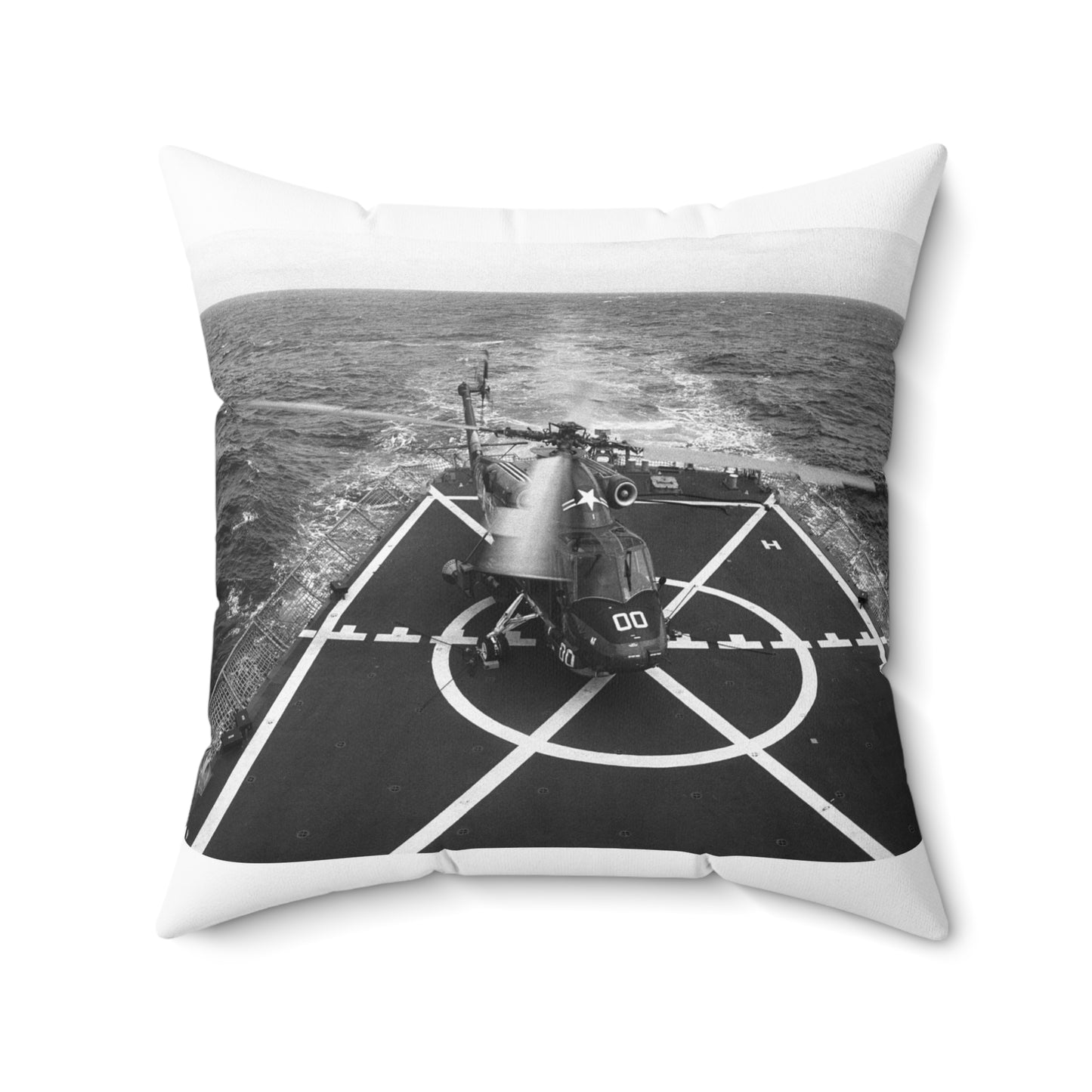 Tie-down chains anchor a Helicopter Light Anti-submarine Squadron 84 (HSL-84) SH-2F Sea Sprite helicopter to the pad of the guided missile frigate USS SIDES (FFG 14). The SIDES is underway off North Island, California Decorative Accent Square Pillow