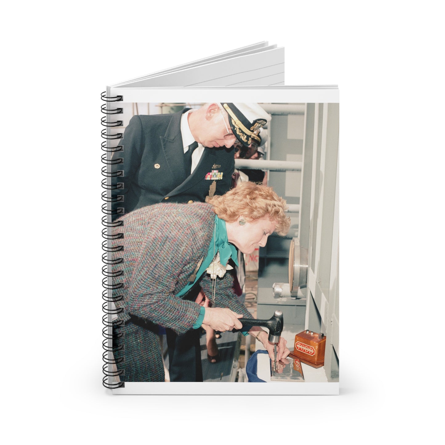 Mrs. E. Meese and Captain (CAPT) R.H. Randall, supervisor of Shipbuilding, Conversion, and Repair, participate in the keel laying of the guided missile frigate Rodney M. Davis (FFG 60) Spiral Bound Ruled Notebook with Printed Cover