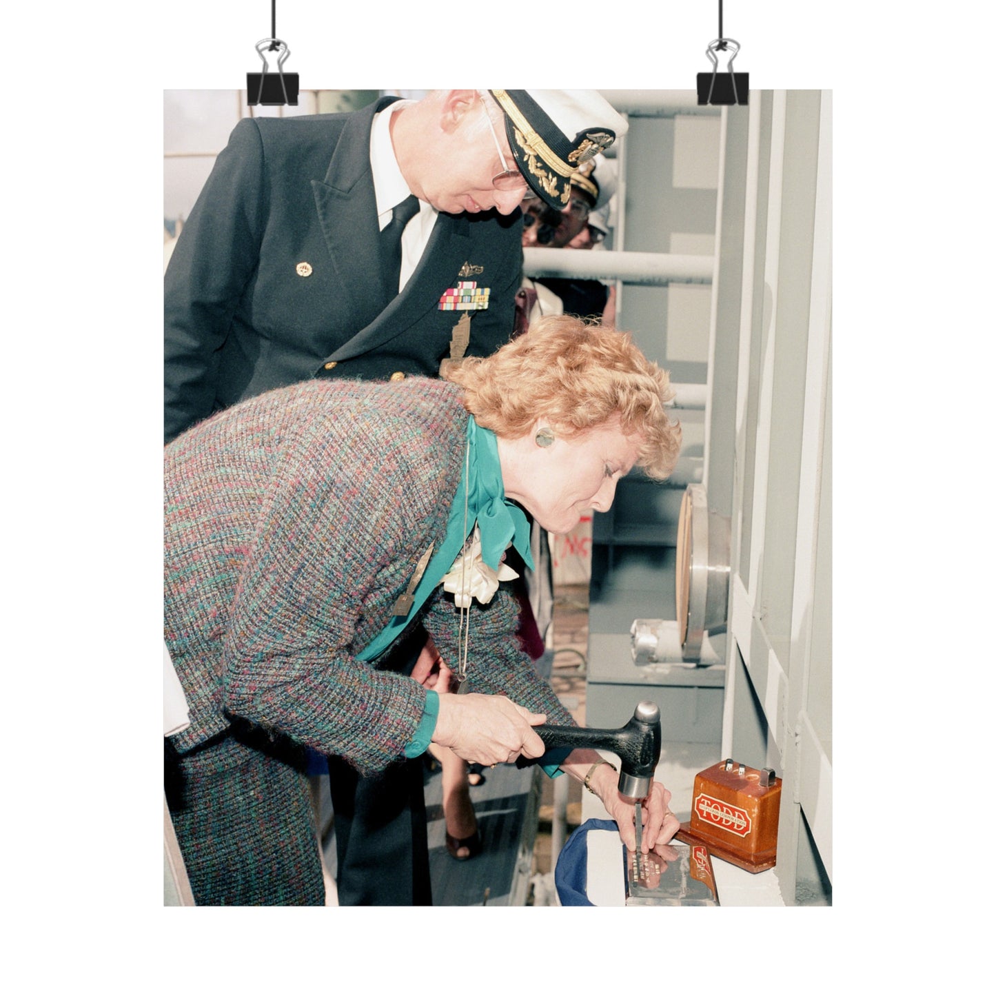 Mrs. E. Meese and Captain (CAPT) R.H. Randall, supervisor of Shipbuilding, Conversion, and Repair, participate in the keel laying of the guided missile frigate Rodney M. Davis (FFG 60) High Quality Matte Wall Art Poster for Home, Office, Classroom