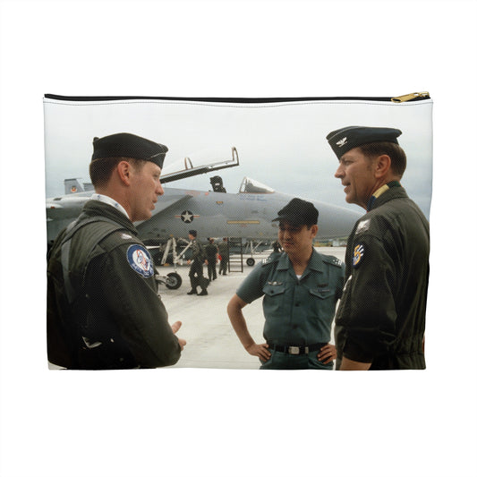 Upon his arrival, LTC Tom Barber (left), is greeted by Exercise Cope North '81-3 directors, COL George Peacock and Japanese Air SelF Defense Force COL V. Nomura - Accessory Pouch