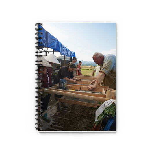 Local workers gather around Dr. Kimberly Maeyama, Defense Spiral Bound Ruled Notebook with Printed Cover