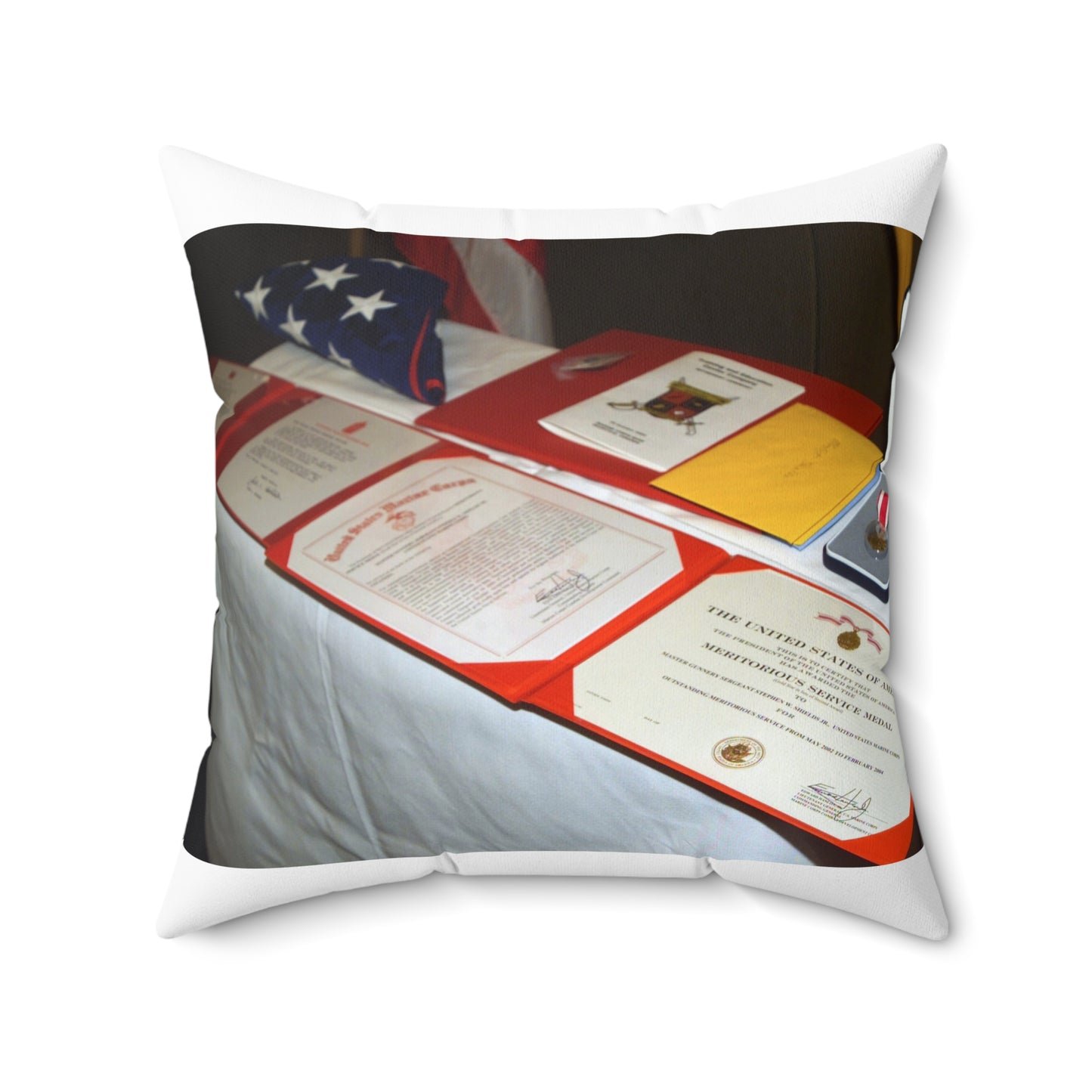 A display of US Marine Corps (USMC) MASTER GUNNERY Sergeant (MGYSGT) Stephen W. Shields' awards lay on a table during his retirement ceremony, at the Clubs of Quantico, Marine Corps Base (MCB) Quantico, Virginia Decorative Accent Square Pillow