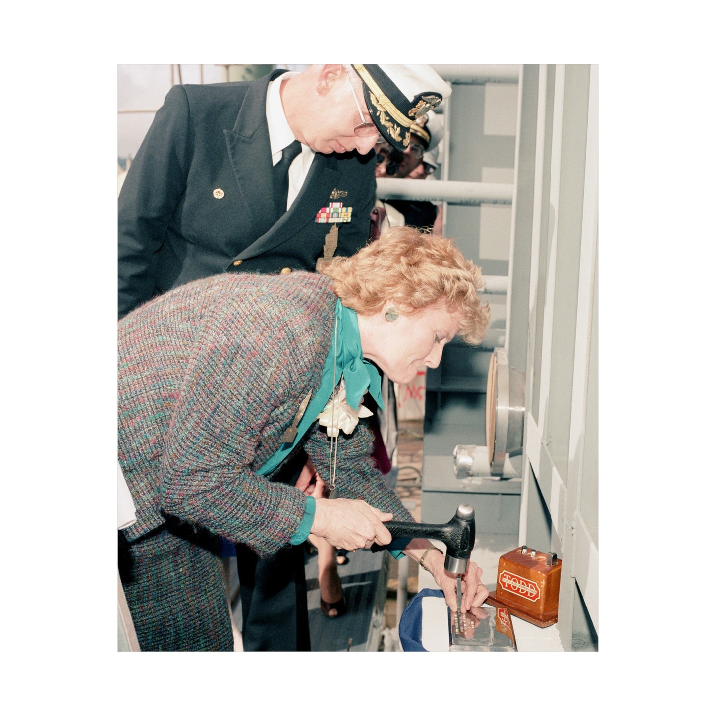 Mrs. E. Meese and Captain (CAPT) R.H. Randall, supervisor of Shipbuilding, Conversion, and Repair, participate in the keel laying of the guided missile frigate Rodney M. Davis (FFG 60) High Quality Matte Wall Art Poster for Home, Office, Classroom