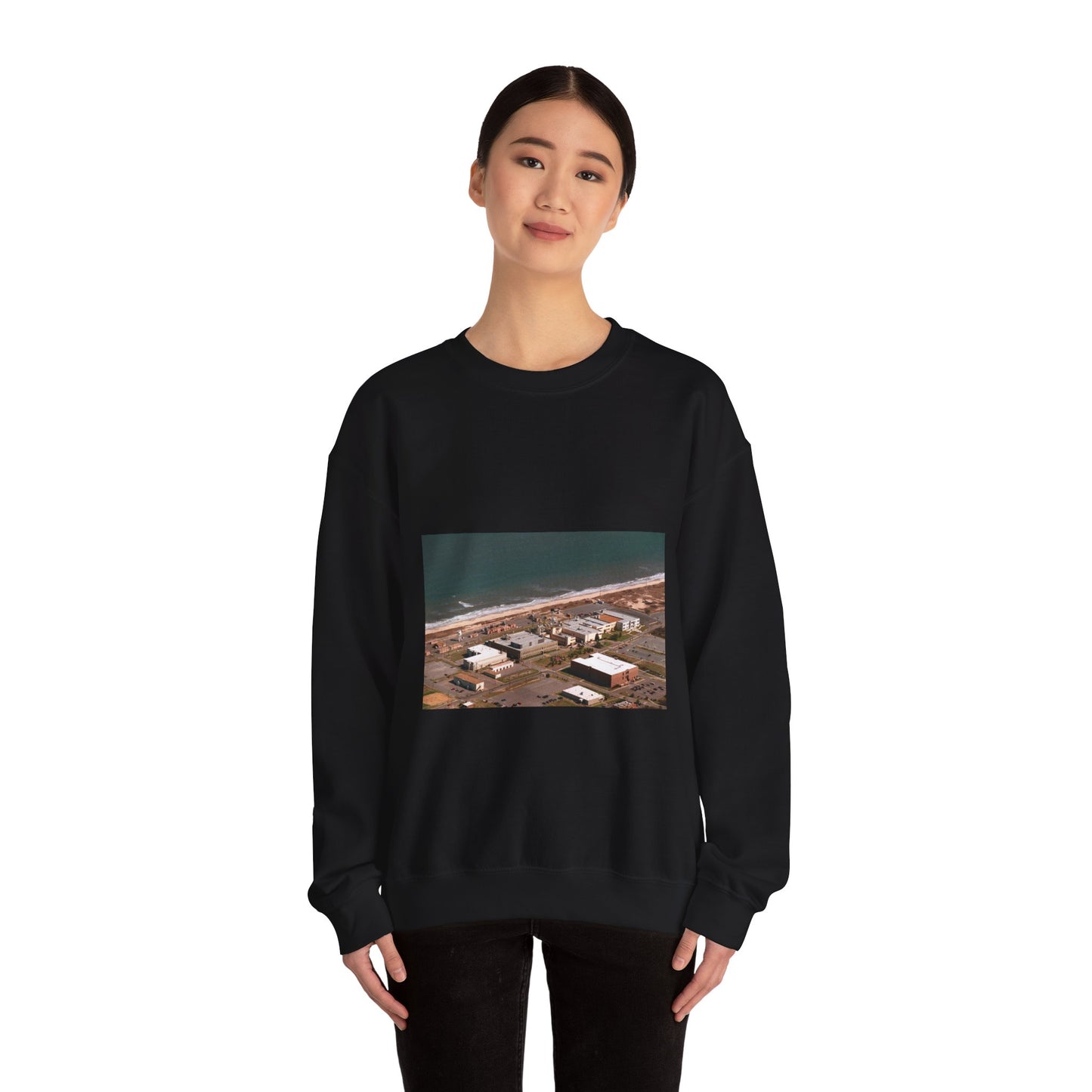 An aerial view of the Naval Surface Warfare Center testing building on the Dam Neck Naval Base. Along the beach are various types of gun mounts with their associated fire control radars atop the test building Black Heavy Blend Adult Crew Neck SweatShirt