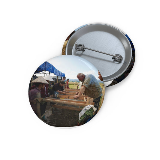 Local workers gather around Dr. Kimberly Maeyama, Defense Pin Buttons with Crisp Design