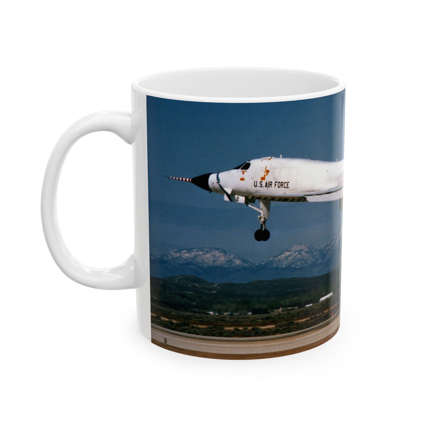 A left side view of the B-1B test program aircraft, originally the No. 2 B-1 prototype, landing after a test flight Beautiful Novelty Ceramic Coffee Mug 11oz