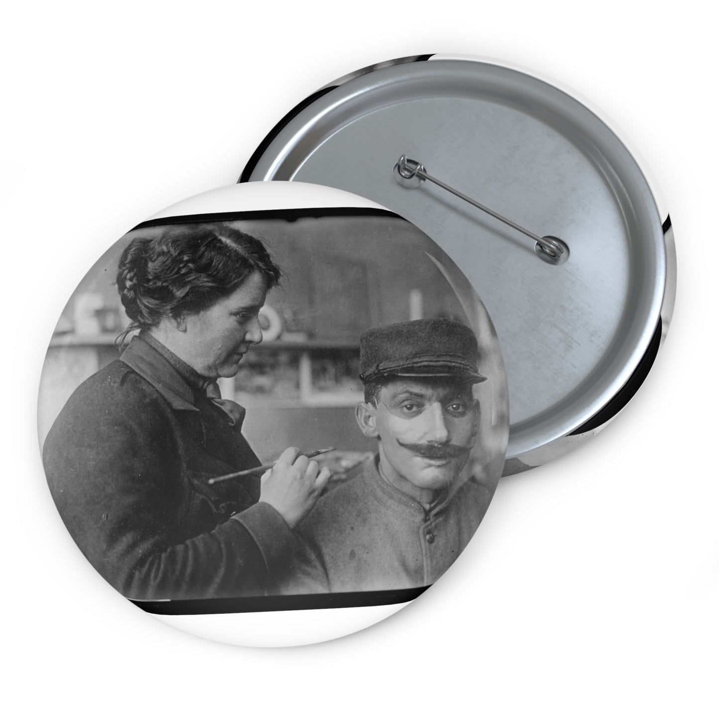 Mrs. Anna Coleman Ladd and Mr Caudron. Mrs. A. Coleman Ladd working on portrait mask Pin Buttons with Crisp Design