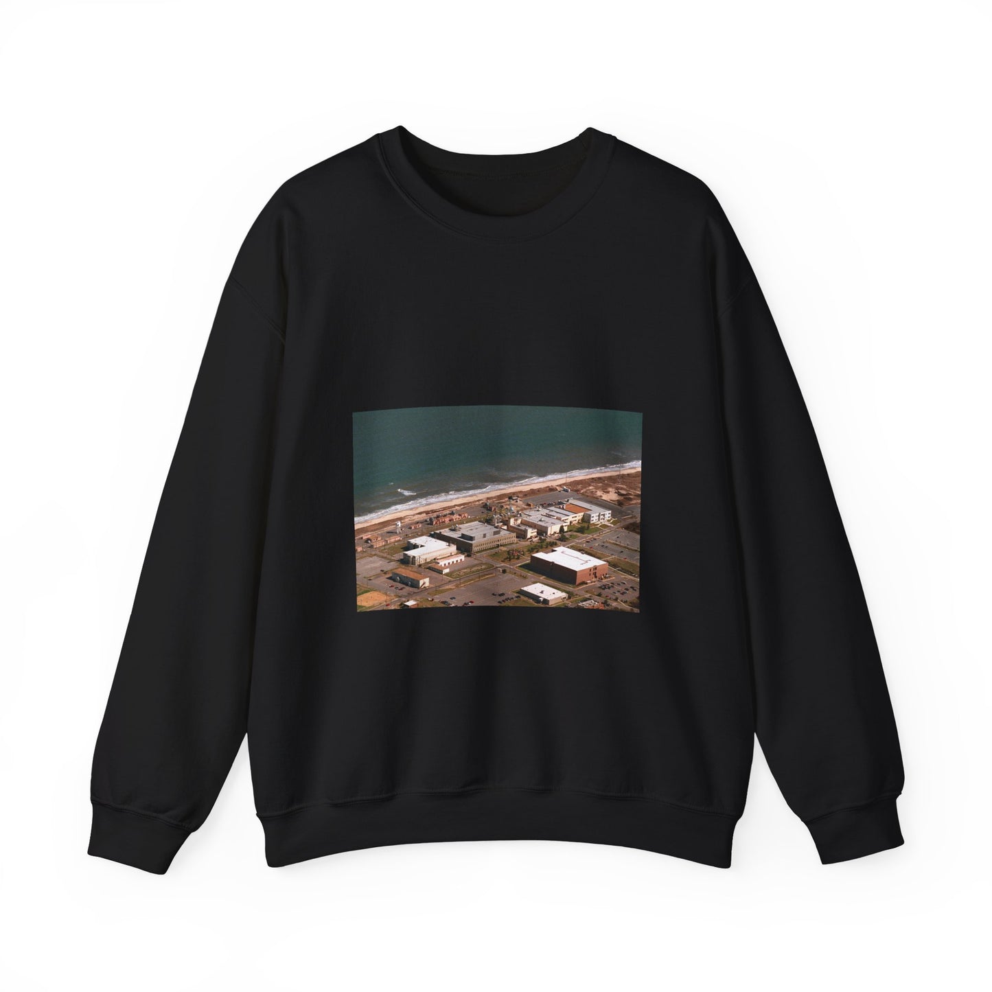 An aerial view of the Naval Surface Warfare Center testing building on the Dam Neck Naval Base. Along the beach are various types of gun mounts with their associated fire control radars atop the test building Black Heavy Blend Adult Crew Neck SweatShirt