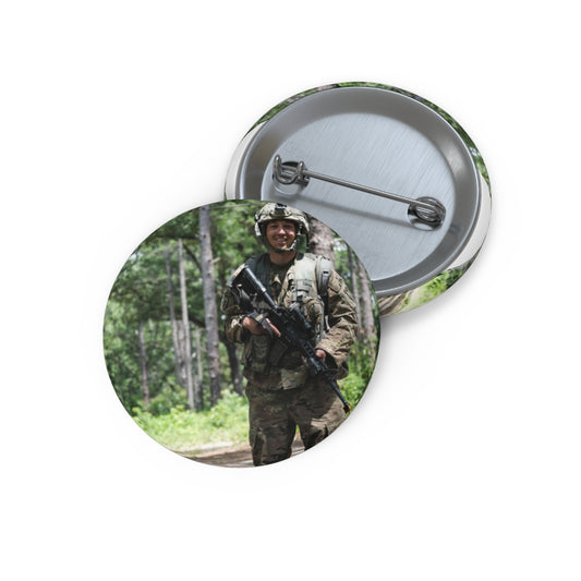 1st Lt. Jamieson Barnes an officer with Headquarters, Pin Buttons with Crisp Design