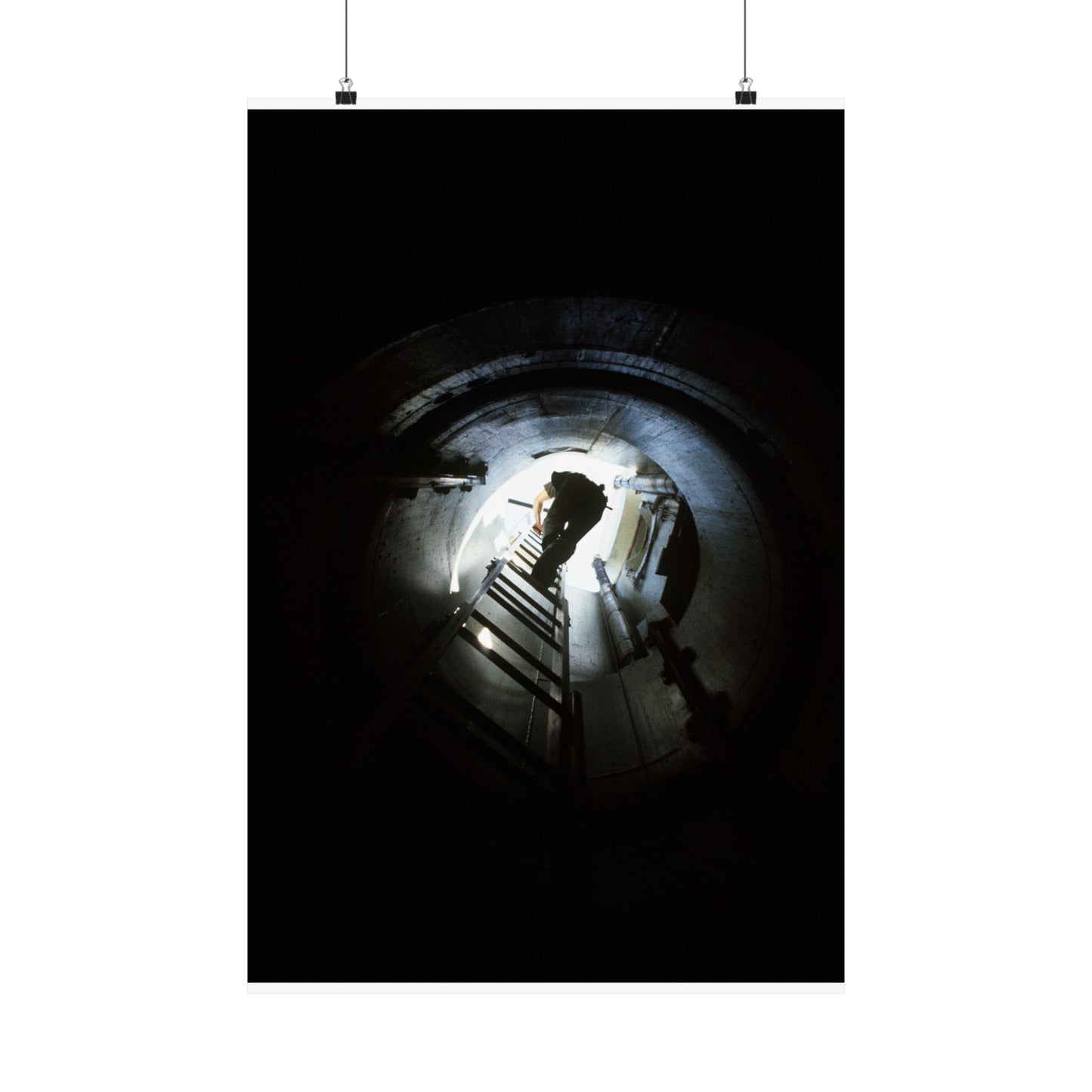 A 44th Field Missile Maintenance Squadron maintenance technician climbs down a ladder into a Minuteman missile support facility High Quality Matte Wall Art Poster for Home, Office, Classroom