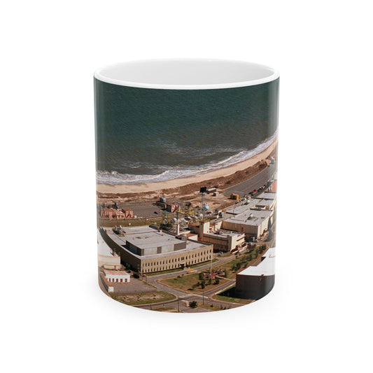 An aerial view of the Naval Surface Warfare Center testing building on the Dam Neck Naval Base. Along the beach are various types of gun mounts with their associated fire control radars atop the test building Beautiful Novelty Ceramic Coffee Mug 11oz