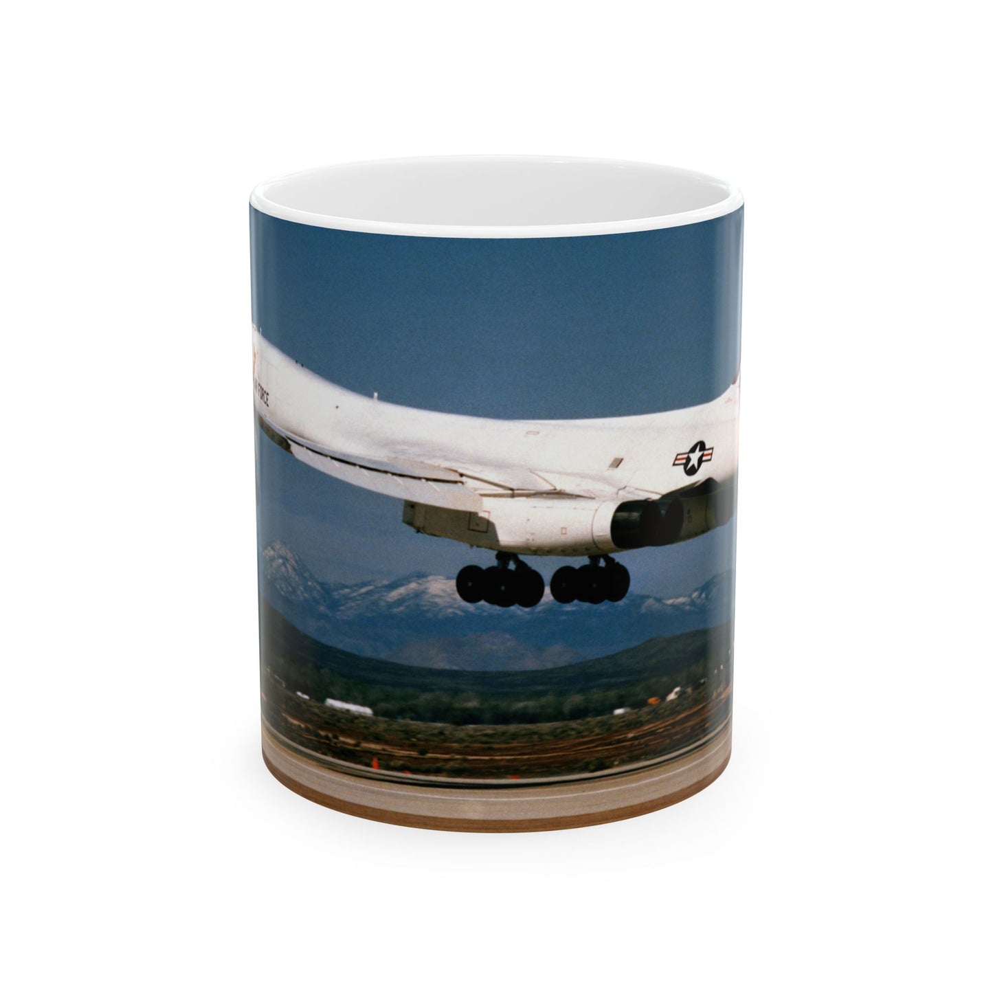 A left side view of the B-1B test program aircraft, originally the No. 2 B-1 prototype, landing after a test flight Beautiful Novelty Ceramic Coffee Mug 11oz