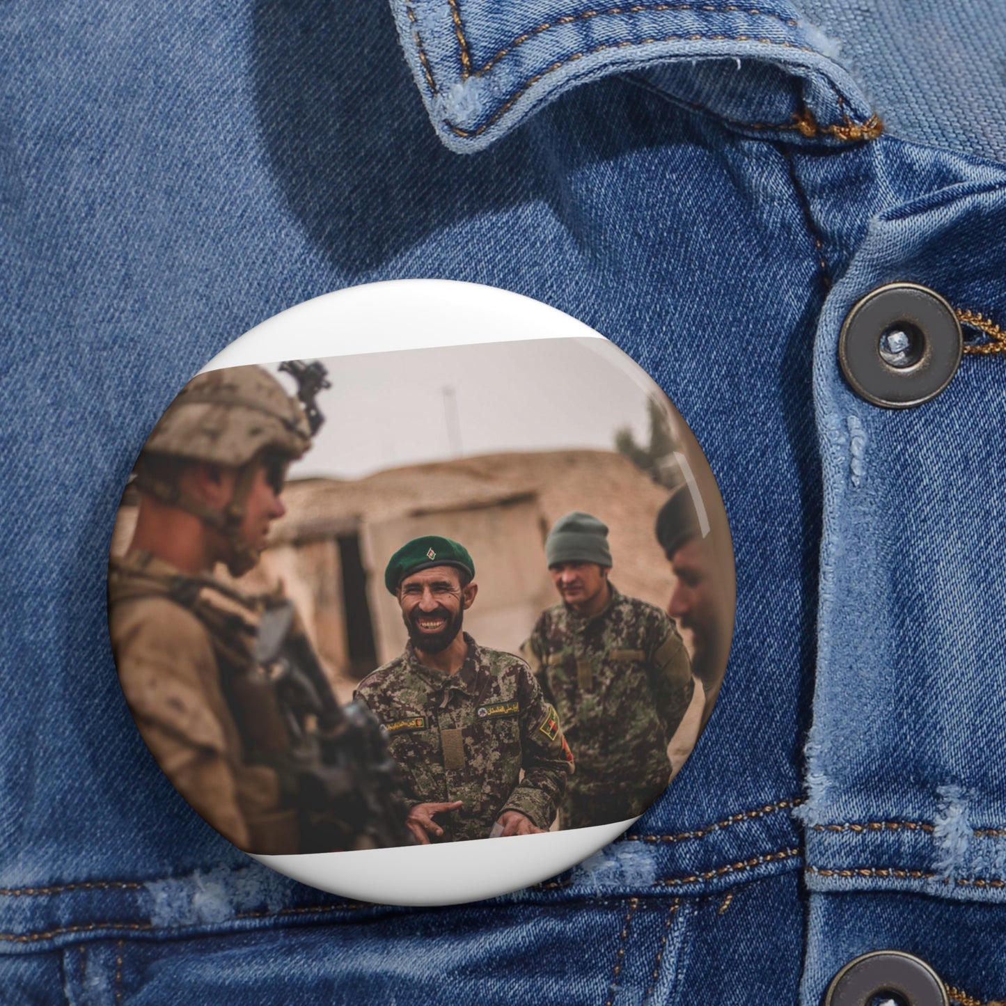 A U.S. Marine with Task Force Southwest (TFSW) converses Pin Buttons with Crisp Design