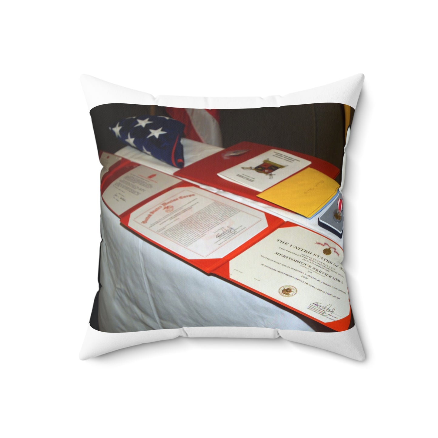 A display of US Marine Corps (USMC) MASTER GUNNERY Sergeant (MGYSGT) Stephen W. Shields' awards lay on a table during his retirement ceremony, at the Clubs of Quantico, Marine Corps Base (MCB) Quantico, Virginia Decorative Accent Square Pillow