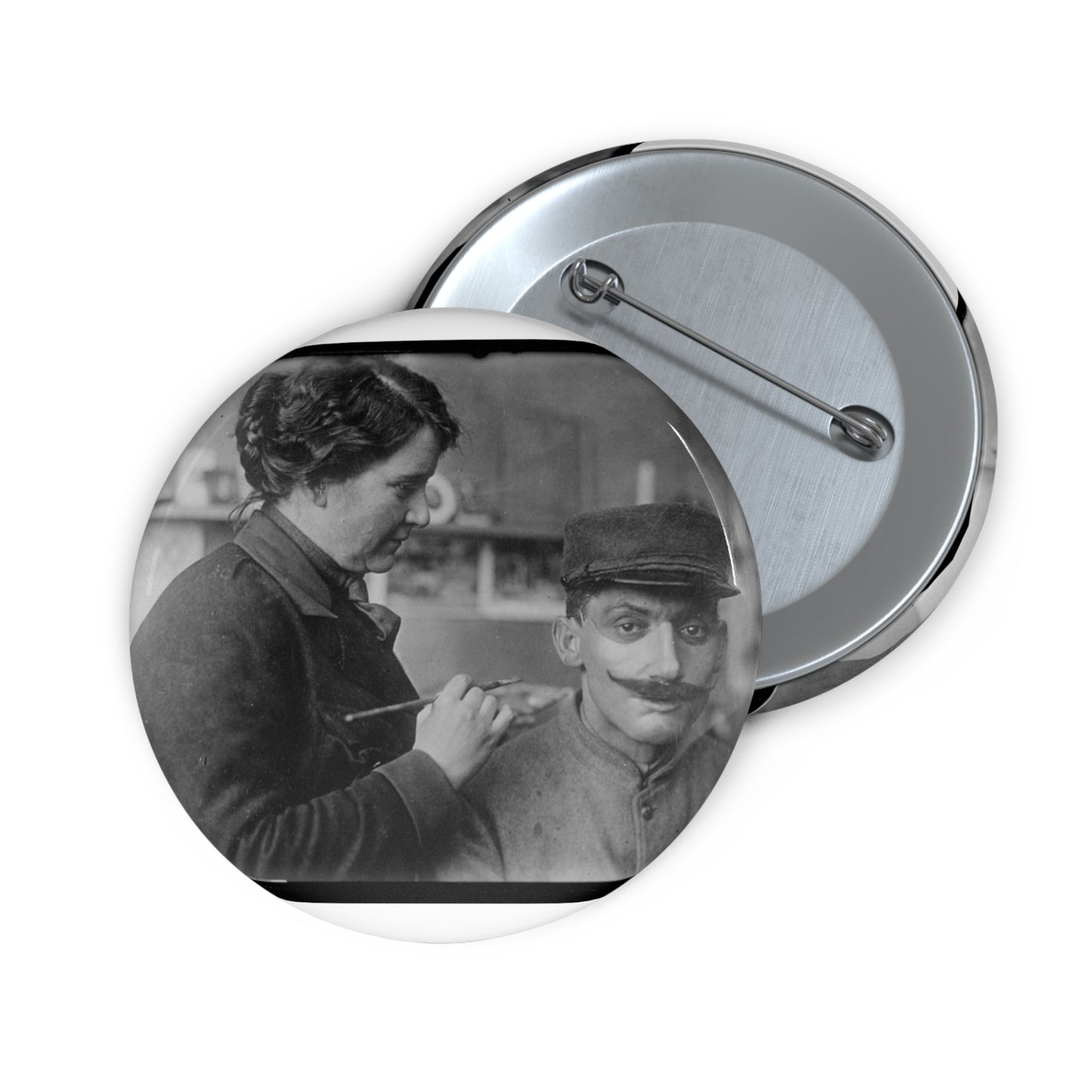 Mrs. Anna Coleman Ladd and Mr Caudron. Mrs. A. Coleman Ladd working on portrait mask Pin Buttons with Crisp Design