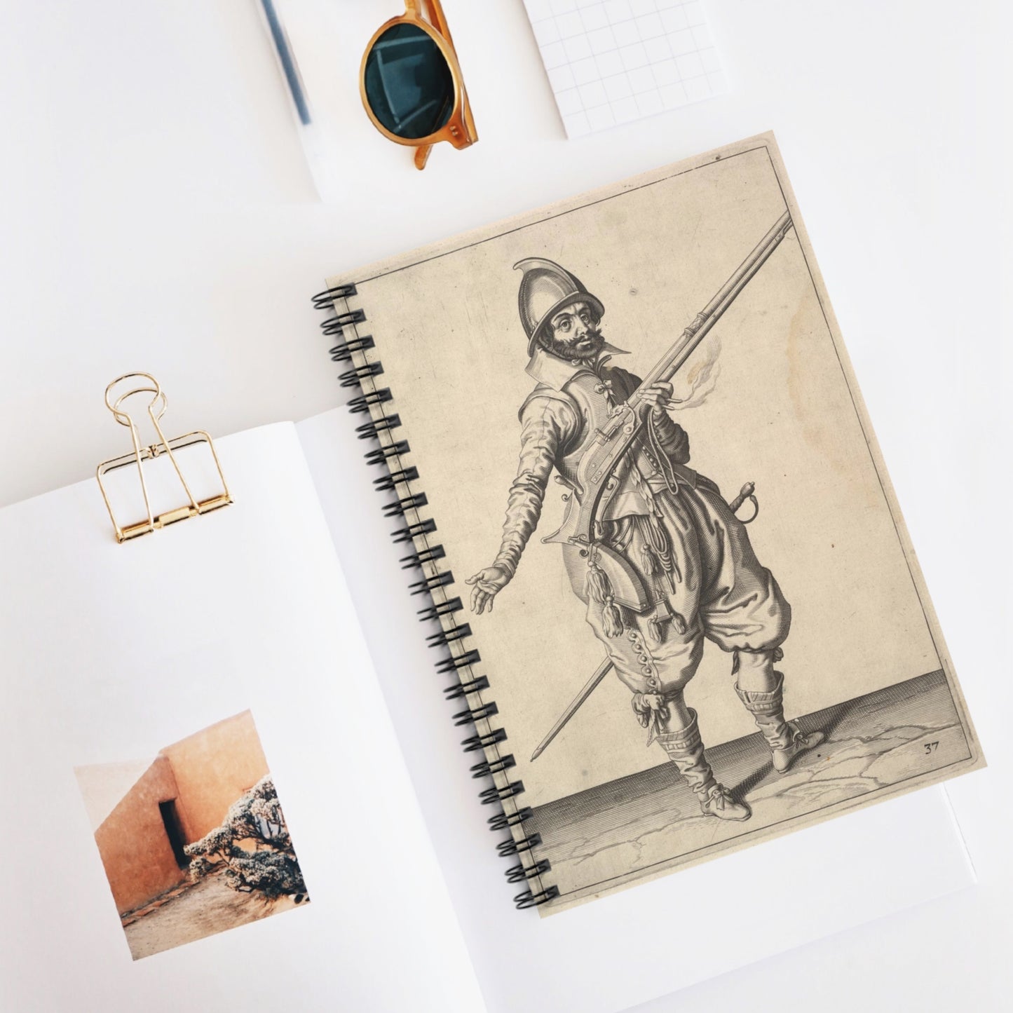 A soldier on guard freeing his right hand, from the Marksmen series, plate 37, in Wapenhandelinghe van Roers Musquetten Ende Spiessen (The Exercise of Arms) Spiral Bound Ruled Notebook with Printed Cover