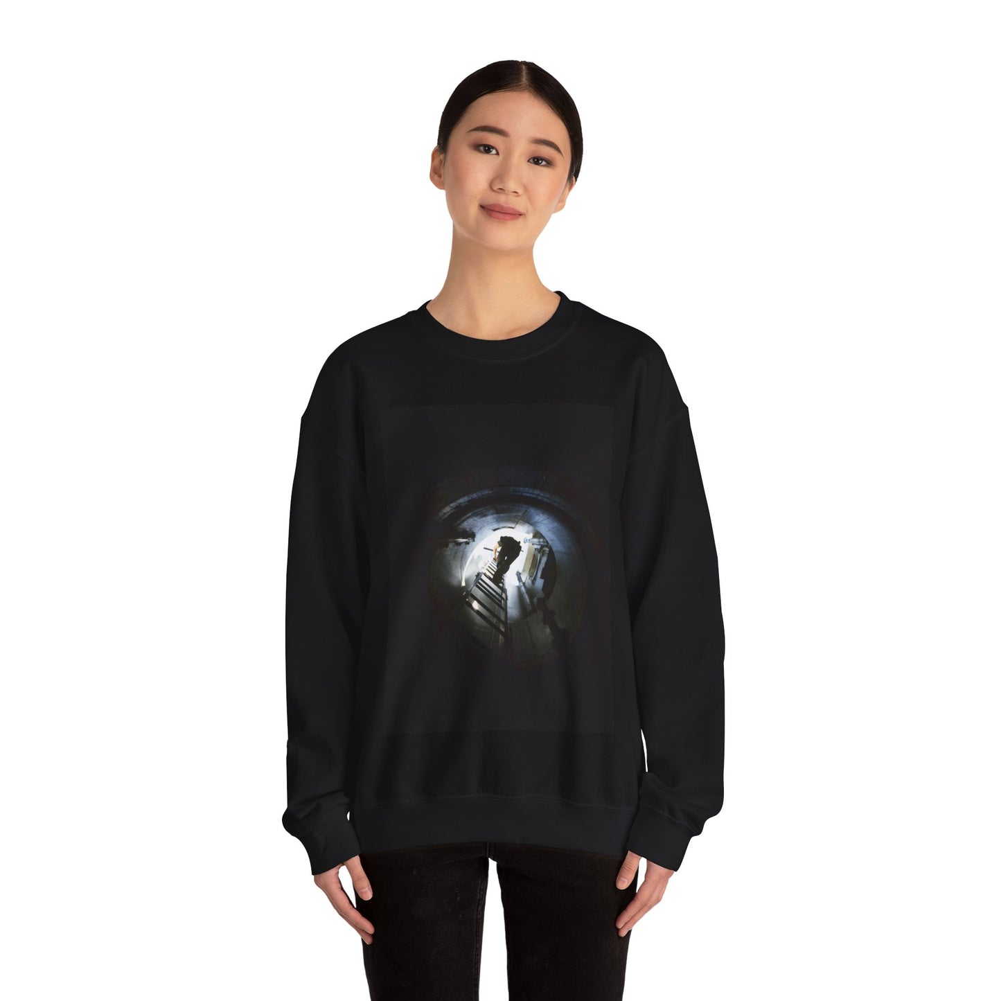 A 44th Field Missile Maintenance Squadron maintenance technician climbs down a ladder into a Minuteman missile support facility Black Heavy Blend Adult Crew Neck SweatShirt