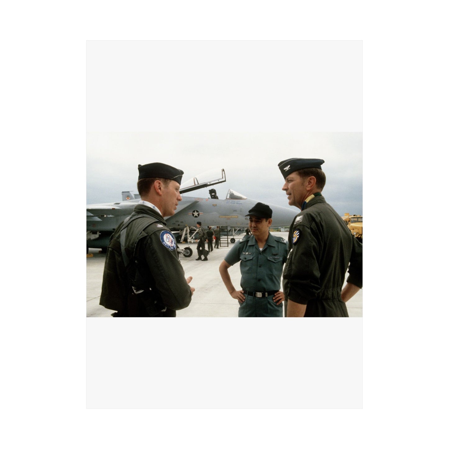 Upon his arrival, LTC Tom Barber (left), is greeted by Exercise Cope North '81-3 directors, COL George Peacock and Japanese Air SelF Defense Force COL V. Nomura High Quality Matte Wall Art Poster for Home, Office, Classroom