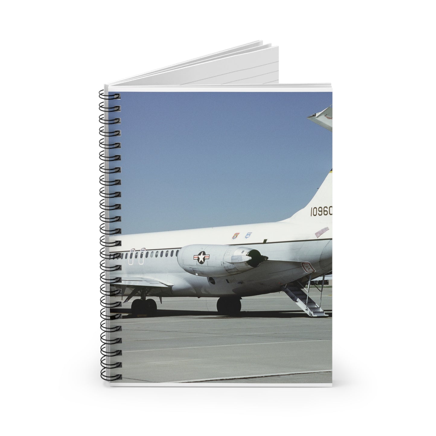 A left rear view of a 375th Aeromedical Airlift Wing a C-9 Nightingale aircraft on the flight line with staircase and loading ramp inposition Spiral Bound Ruled Notebook with Printed Cover