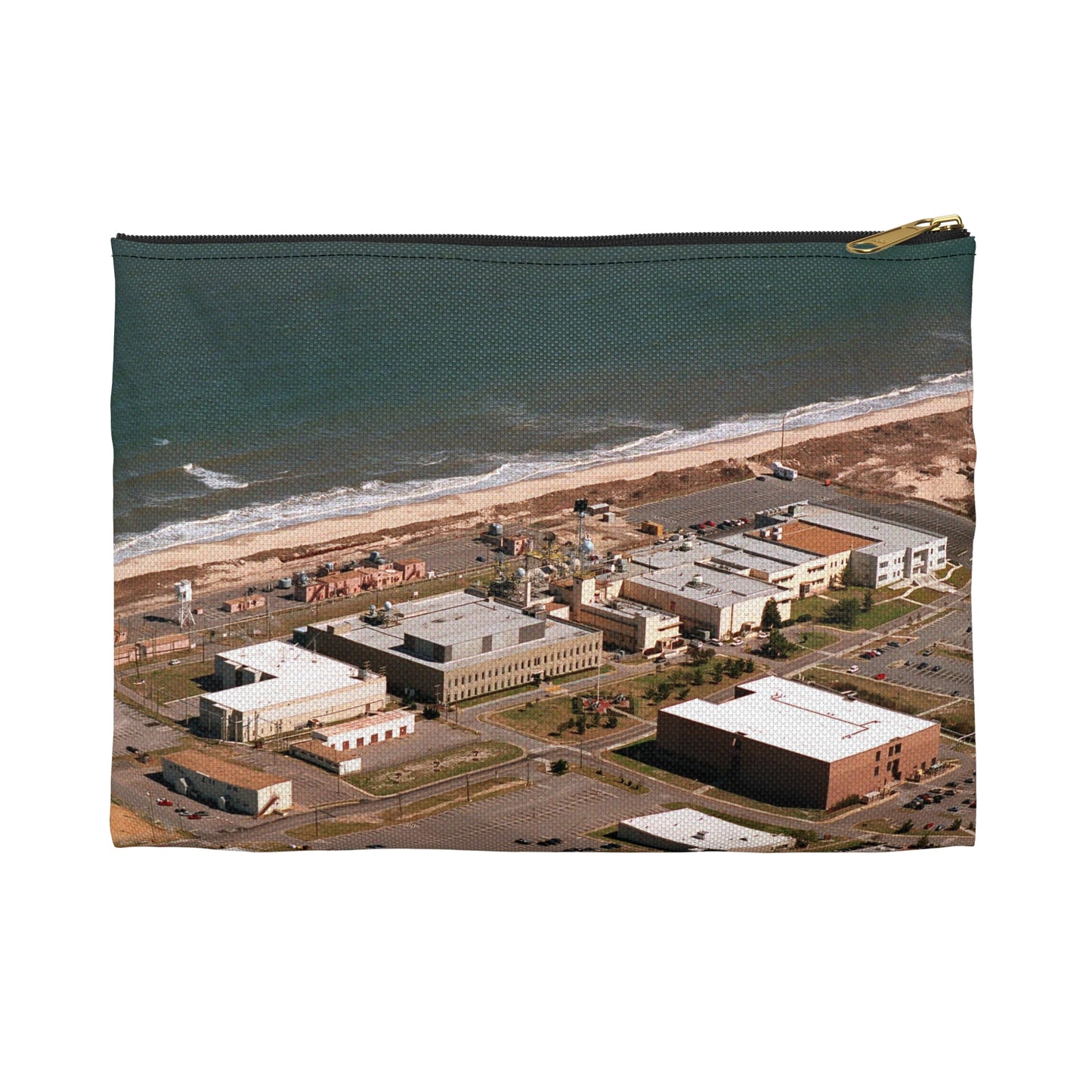 An aerial view of the Naval Surface Warfare Center testing building on the Dam Neck Naval Base. Along the beach are various types of gun mounts with their associated fire control radars atop the test building Large Organizer Pouch with Black Zipper