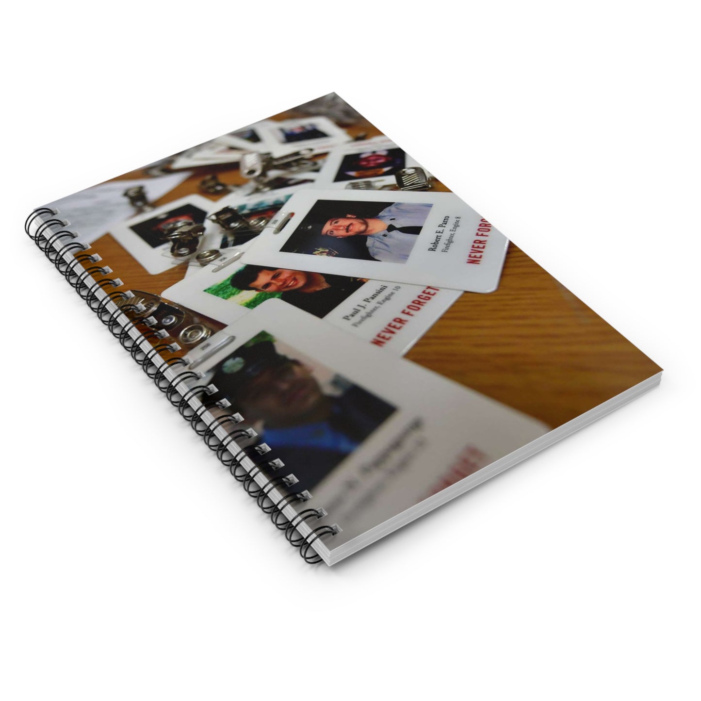 Badges with photos of 9/11 emergency responders, sit Spiral Bound Ruled Notebook with Printed Cover