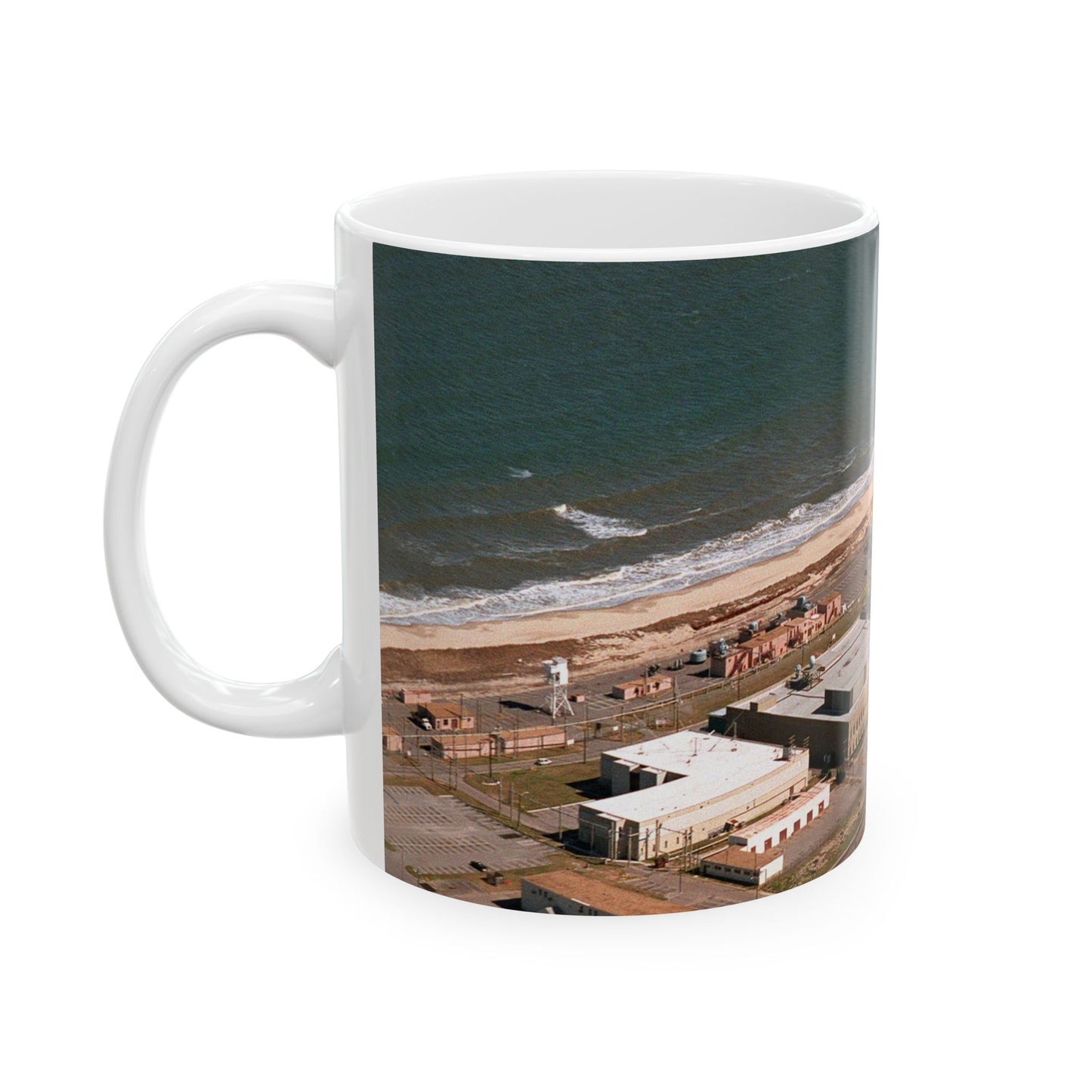 An aerial view of the Naval Surface Warfare Center testing building on the Dam Neck Naval Base. Along the beach are various types of gun mounts with their associated fire control radars atop the test building Beautiful Novelty Ceramic Coffee Mug 11oz