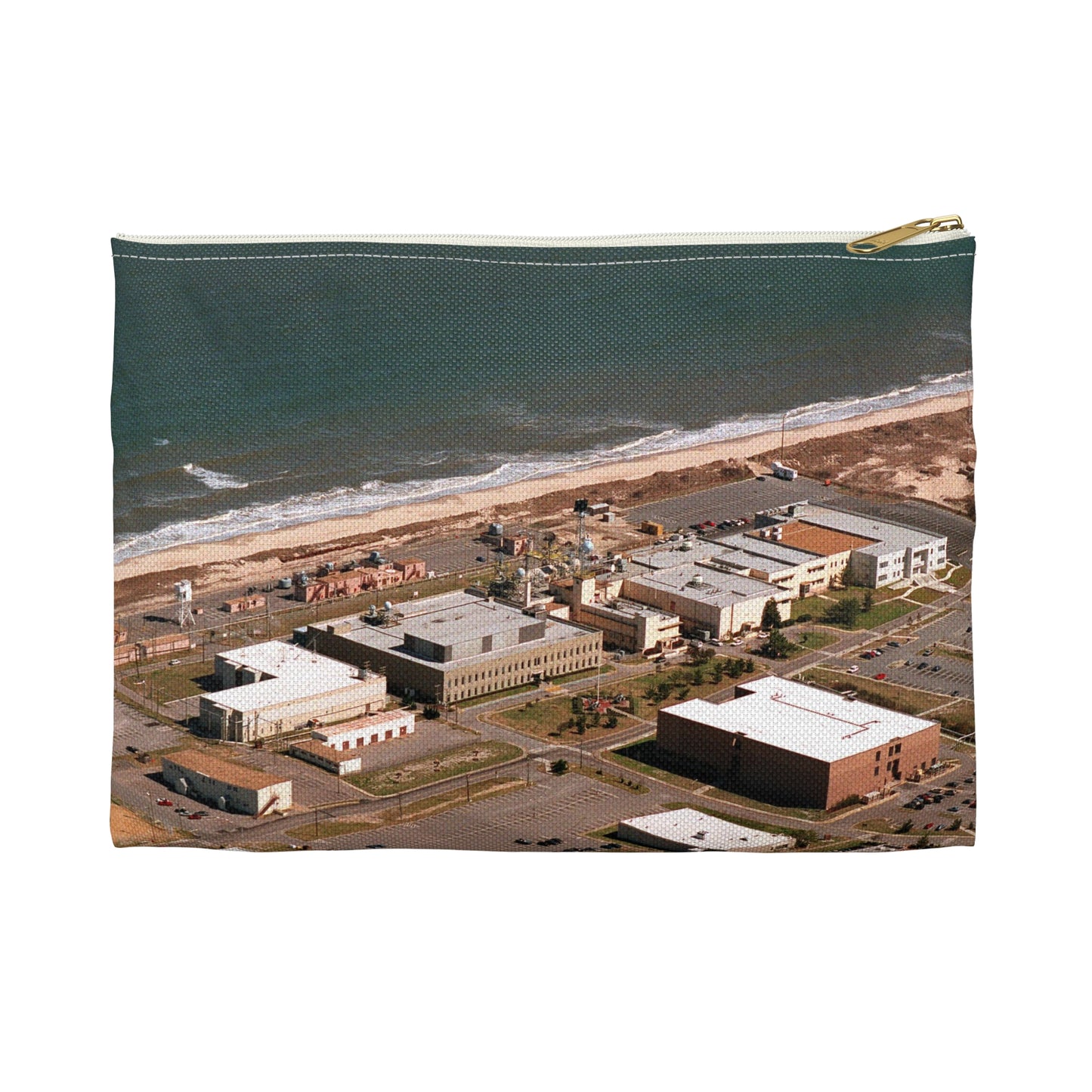 An aerial view of the Naval Surface Warfare Center testing building on the Dam Neck Naval Base. Along the beach are various types of gun mounts with their associated fire control radars atop the test building Large Organizer Pouch with Black Zipper