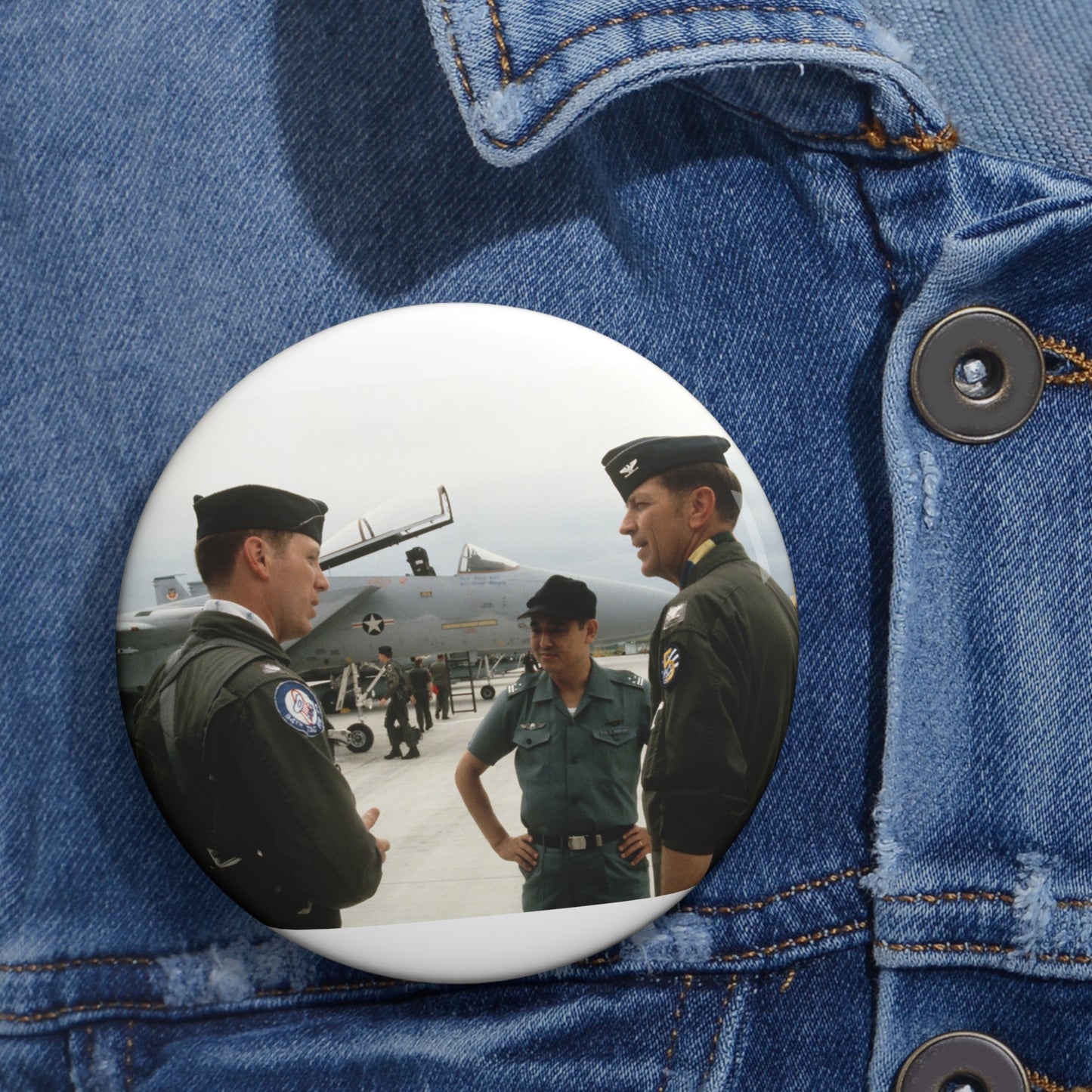 Upon his arrival, LTC Tom Barber (left), is greeted by Exercise Cope North '81-3 directors, COL George Peacock and Japanese Air SelF Defense Force COL V. Nomura Pin Buttons with Crisp Design