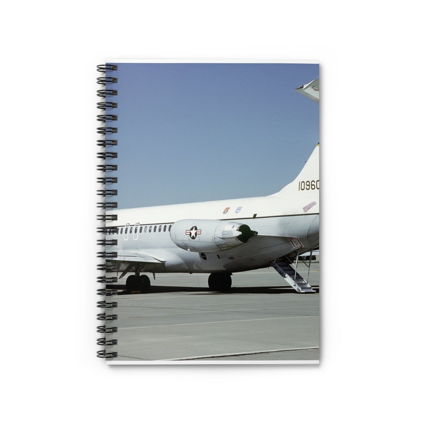 A left rear view of a 375th Aeromedical Airlift Wing a C-9 Nightingale aircraft on the flight line with staircase and loading ramp inposition Spiral Bound Ruled Notebook with Printed Cover