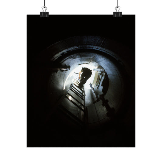 A 44th Field Missile Maintenance Squadron maintenance technician climbs down a ladder into a Minuteman missile support facility High Quality Matte Wall Art Poster for Home, Office, Classroom