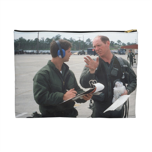 Colonel Tom Barber (right), director of operations, 33rd Tactical Fighter Wing (33rd TFW) is debriefed by First Lieutenant Robert M. Haire (left), intelligence officer, 33rd TFW - Accessory Pouch